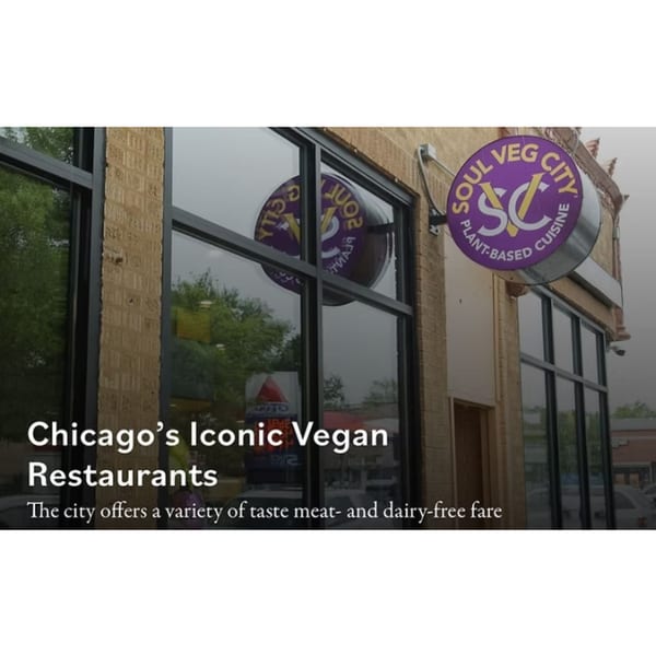 Exterior of Soul Veg City, a vegan restaurant with a purple circular sign on a brick building.