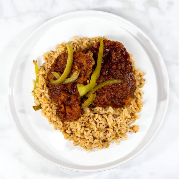 Soul Veg City's vegan sweet and sour chicken with green peppers and brown rice.