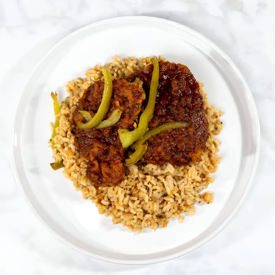 Soul Veg City's vegan sweet and sour chicken with green peppers and brown rice.
